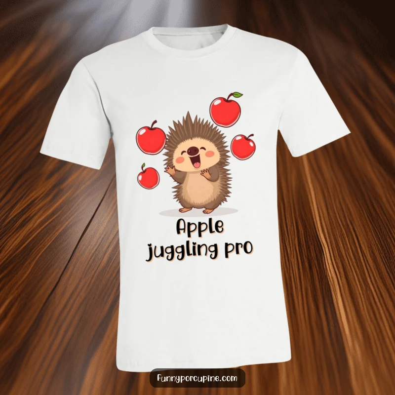 Funny Porcupine T-Shirt: A kawaii porcupine excitedly juggles oversized, bright red apples, showcasing impressive dexterity and cheer.