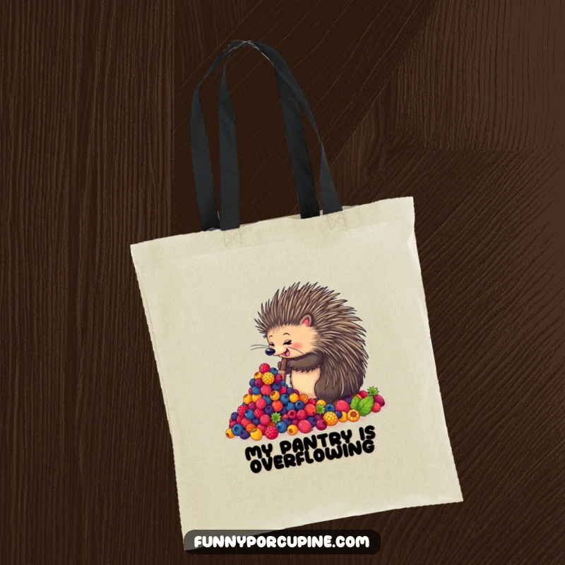 Funny tote bag showcasing an enthusiastic porcupine joyfully shoveling a giant mound of colorful berries, a practical and humorous accessory.